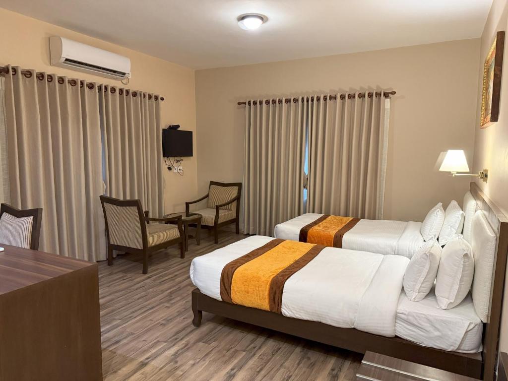 Postel nebo postele na pokoji v ubytování Hotel Shuman, Boudha