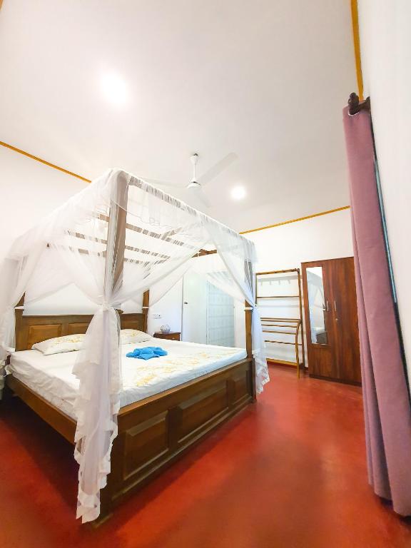 Postel nebo postele na pokoji v ubytování Coco Mount Mirissa