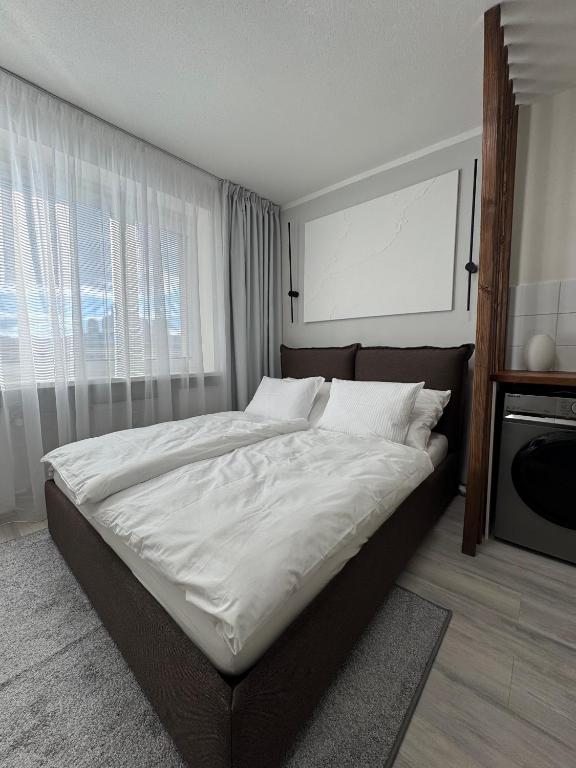 Ένα ή περισσότερα κρεβάτια σε δωμάτιο στο Modern Apartment in the City Center