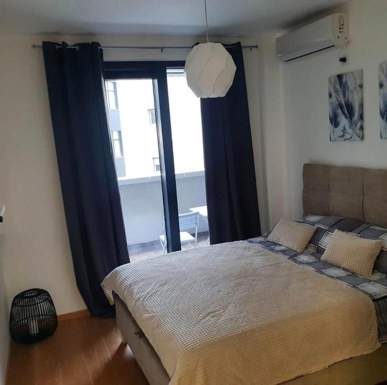 Postel nebo postele na pokoji v ubytování Pupinova palata- Apartman 7