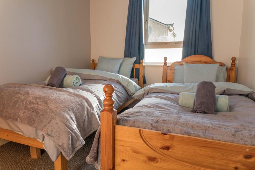 Postel nebo postele na pokoji v ubytování Glancys Accomadation