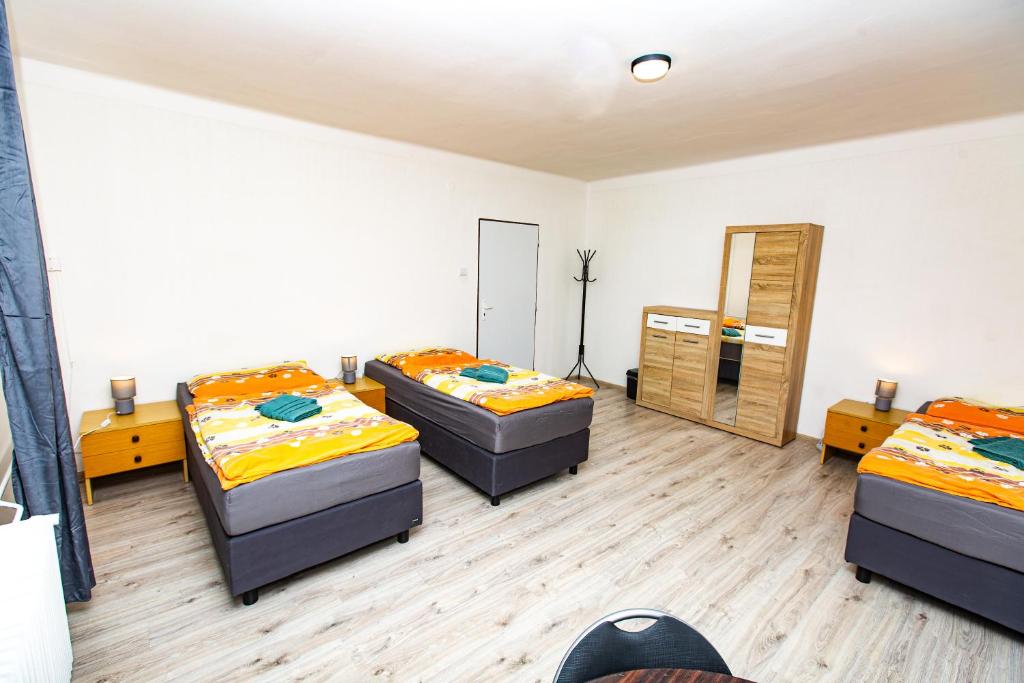 Postel nebo postele na pokoji v ubytování Ubytovanie AJKA