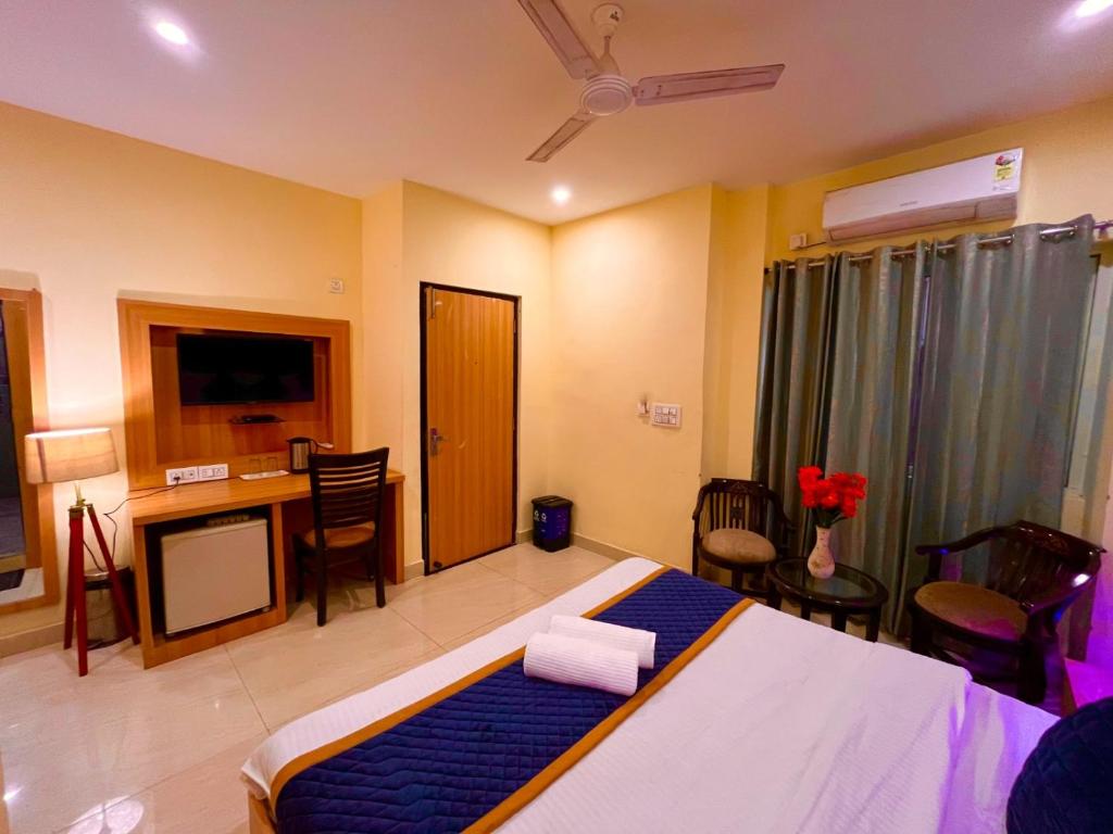 Postel nebo postele na pokoji v ubytování Hotel The Rio, Haridwar
