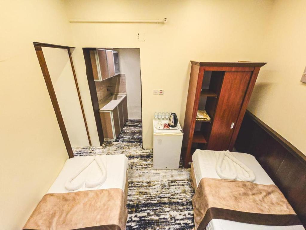 Postel nebo postele na pokoji v ubytování Jawad Al-Taj Hotel