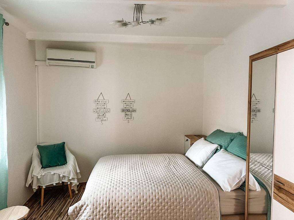 a bedroom with a bed and a mirror at Lucky Star Apartments in City Center in Split