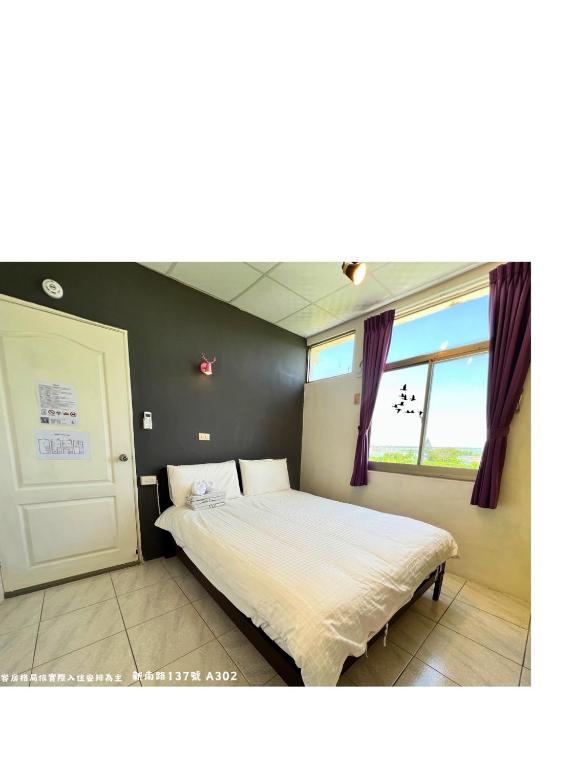 Postel nebo postele na pokoji v ubytování Happy Homestay