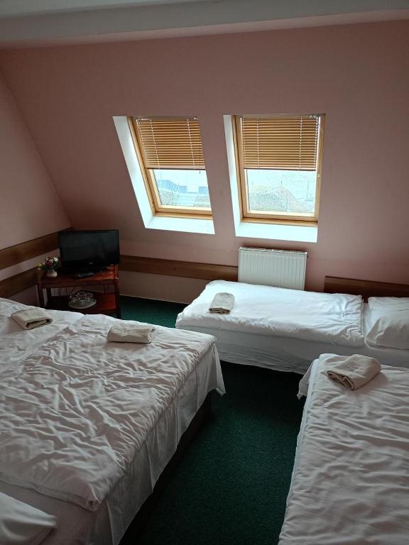 Postel nebo postele na pokoji v ubytování Motel Oseček