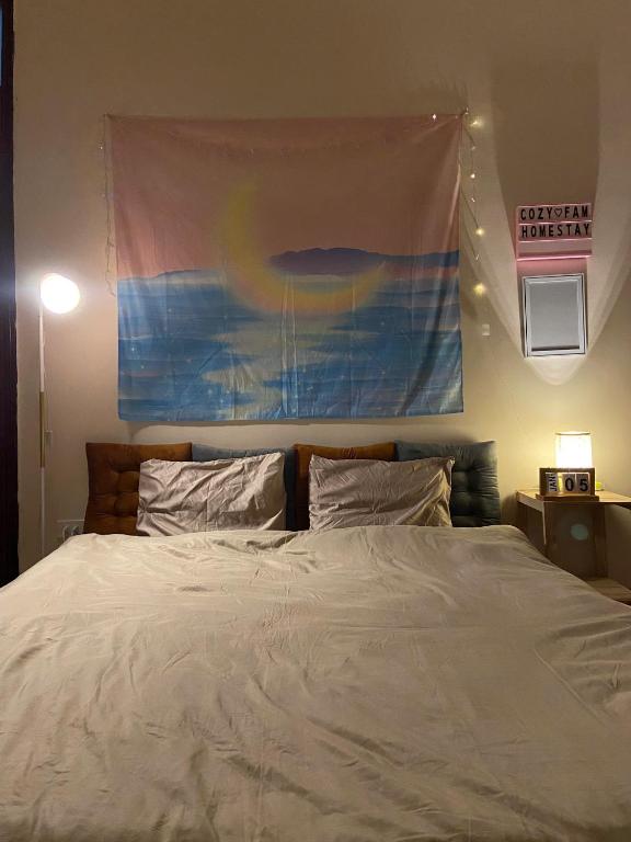 Postel nebo postele na pokoji v ubytování Cozy Fam Homestay Hanoi