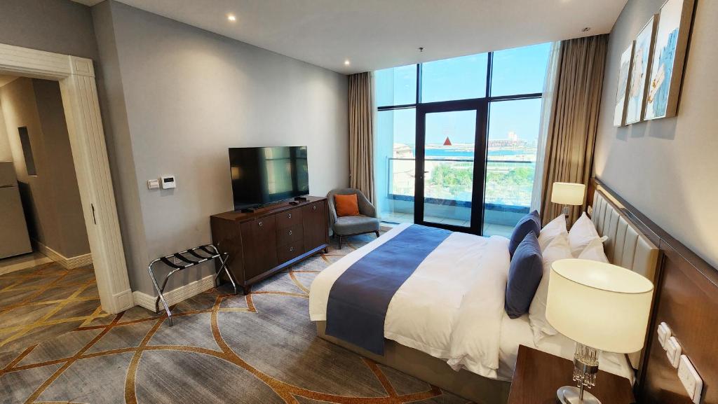 Ένα ή περισσότερα κρεβάτια σε δωμάτιο στο Sherao Hotel Doha فندق شراعوه الدوحة