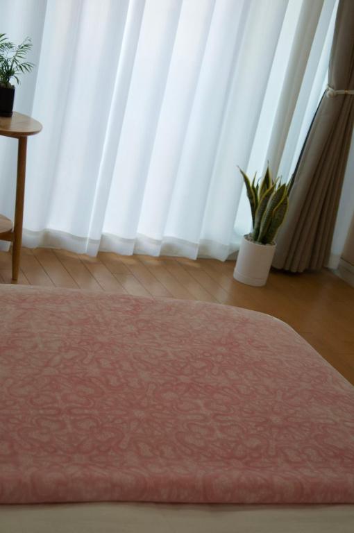 Postel nebo postele na pokoji v ubytování 全新装修南品川haven春
