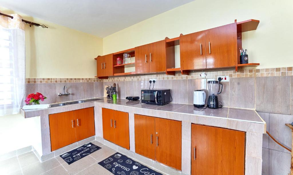 Kuchyň nebo kuchyňský kout v ubytování Diani Beach Gold Apartments