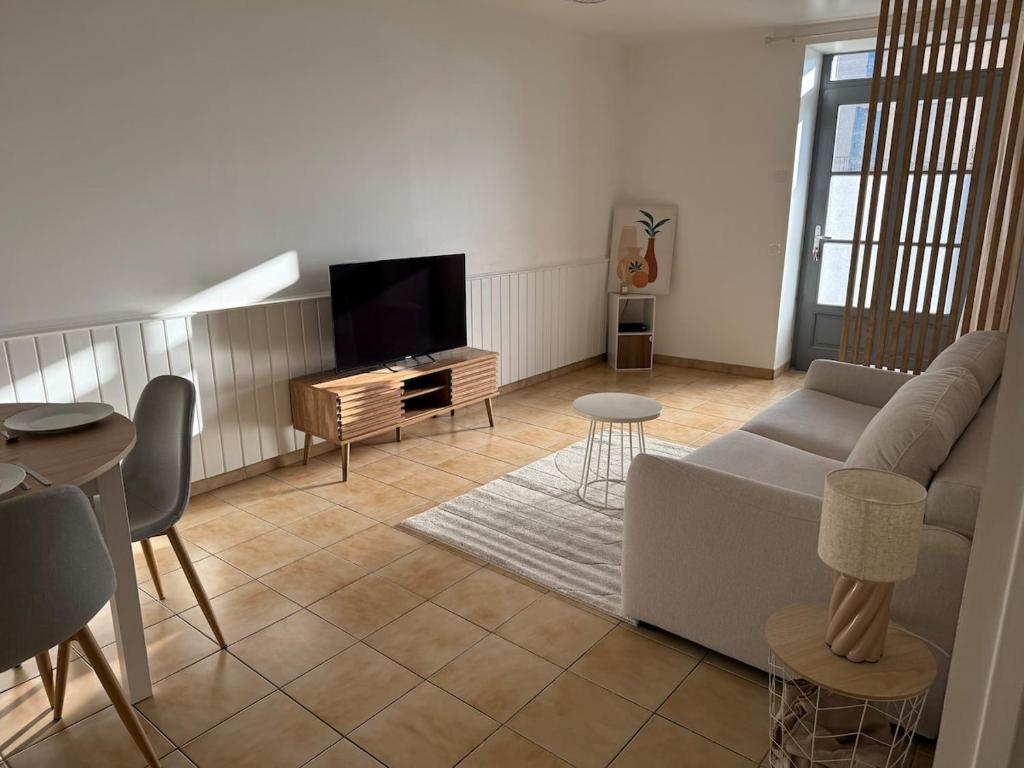 Posezení v ubytování Au cœur de Neuville Appartement 4 pers RDC
