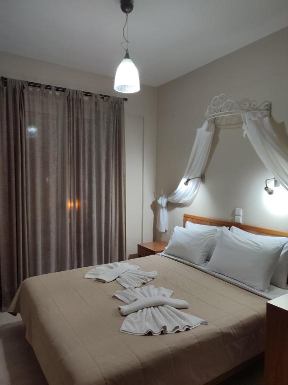 Postel nebo postele na pokoji v ubytování Vassiliki Bay Hotel