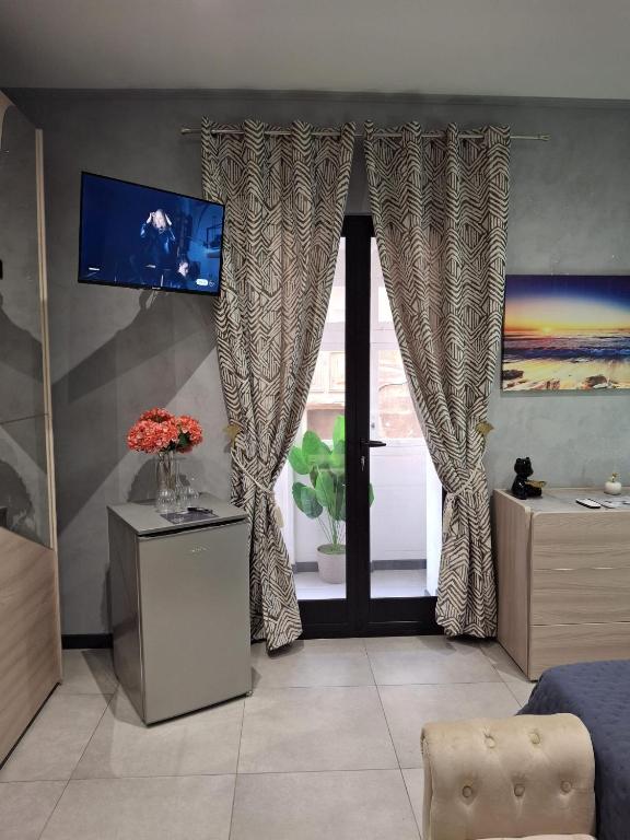 TV a/nebo společenská místnost v ubytování Matilde Valletta Suites