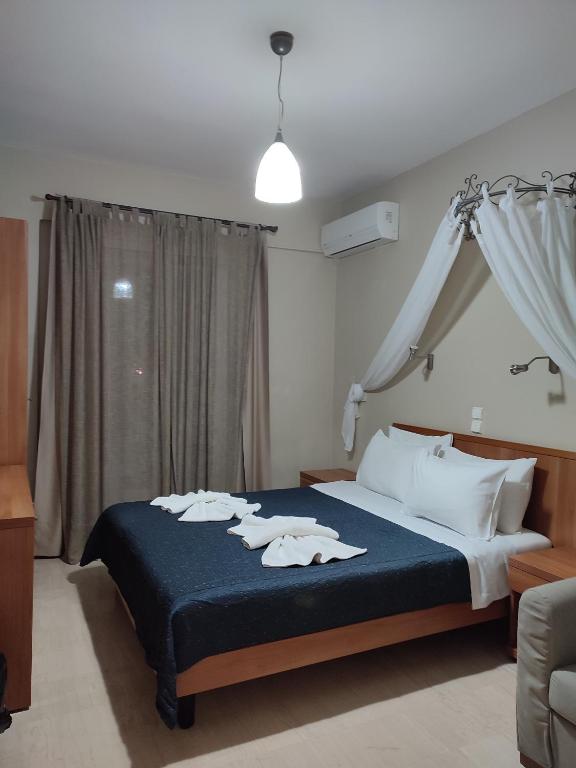 Postel nebo postele na pokoji v ubytování Vassiliki Bay Hotel