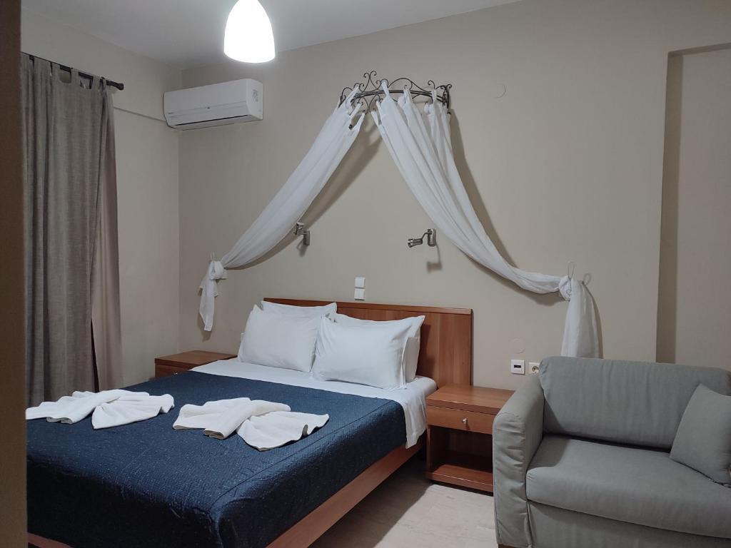 Postel nebo postele na pokoji v ubytování Vassiliki Bay Hotel