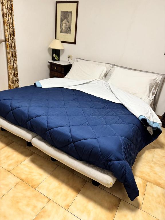Postel nebo postele na pokoji v ubytování Hotel Le Logge