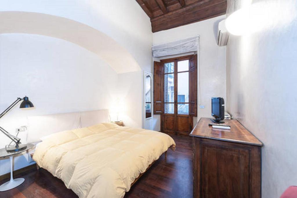 Posteľ alebo postele v izbe v ubytovaní Tornabuoni Apartment