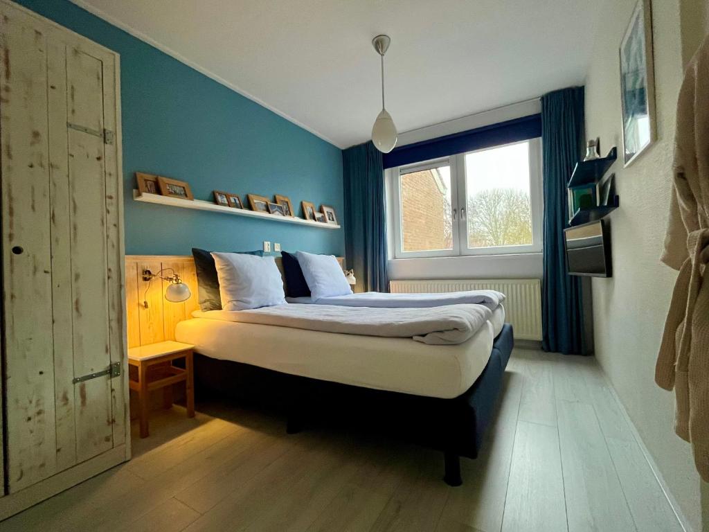 Postel nebo postele na pokoji v ubytování B&B Vloedlijn Texel