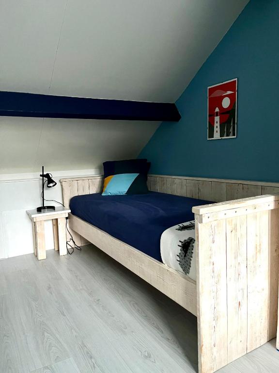 Postel nebo postele na pokoji v ubytování B&B Vloedlijn Texel