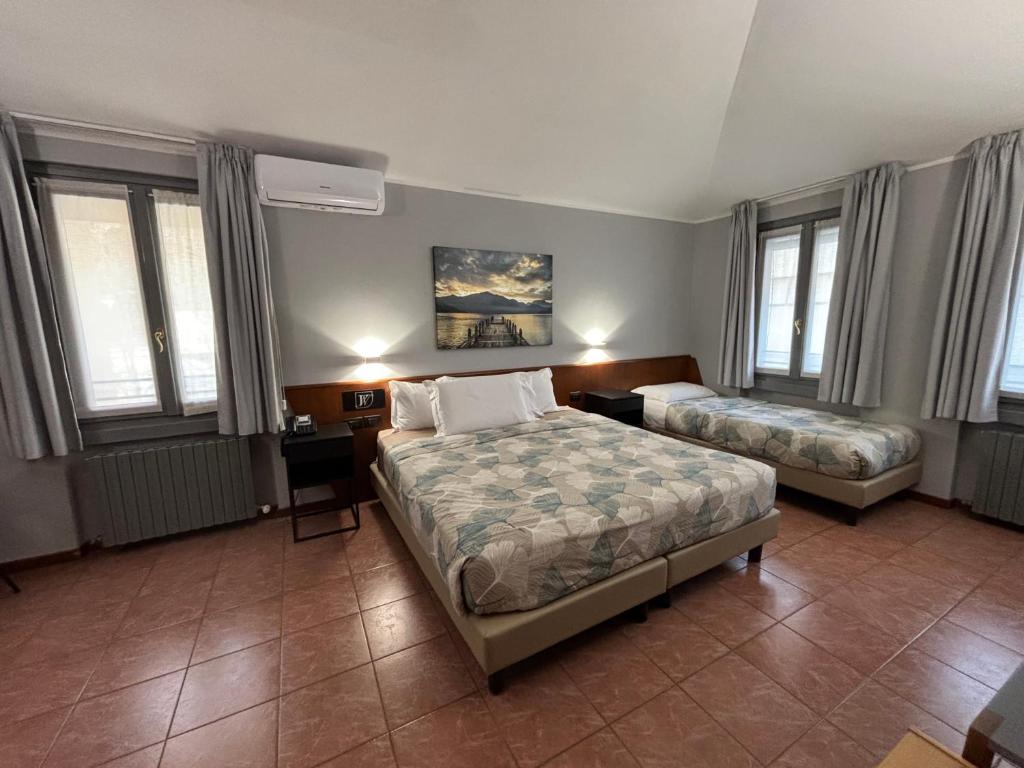 Postel nebo postele na pokoji v ubytování Villa Nasti Hotel Ristorante