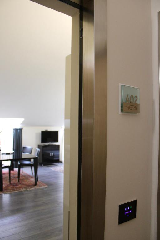 TV a/nebo společenská místnost v ubytování Residenza Agnello D'Oro
