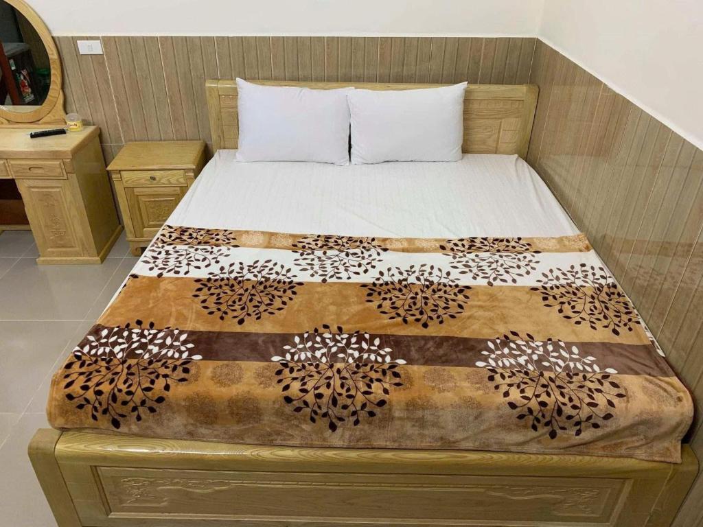 Ένα ή περισσότερα κρεβάτια σε δωμάτιο στο Khách sạn Thái sơn Phú Quốc