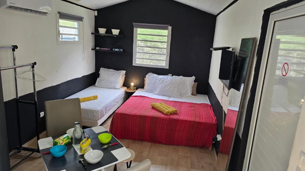 Postel nebo postele na pokoji v ubytování Hébergement Chez l'Habitant - Idéal pour Visiter la Martinique