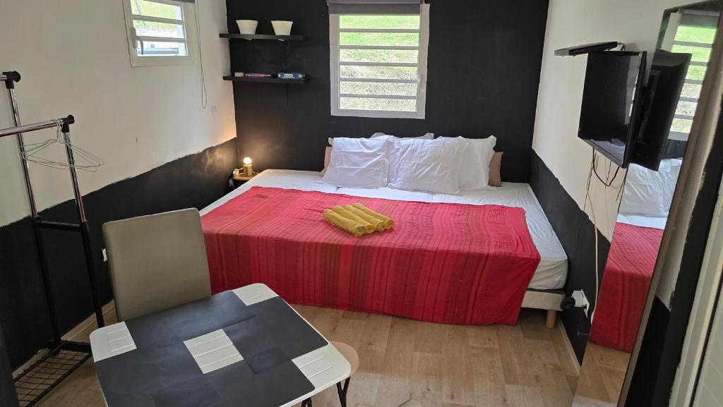 Postel nebo postele na pokoji v ubytování Hébergement Chez l'Habitant - Idéal pour Visiter la Martinique