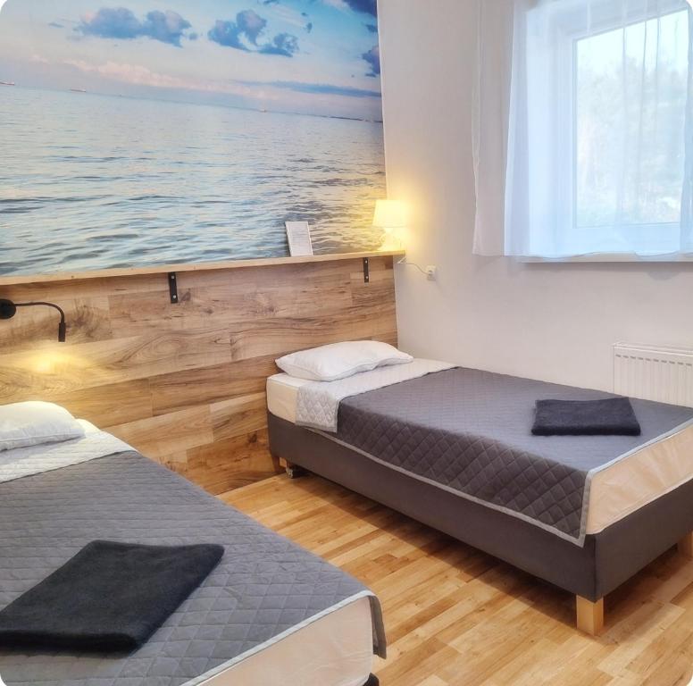 Postel nebo postele na pokoji v ubytování Leśne Zacisze