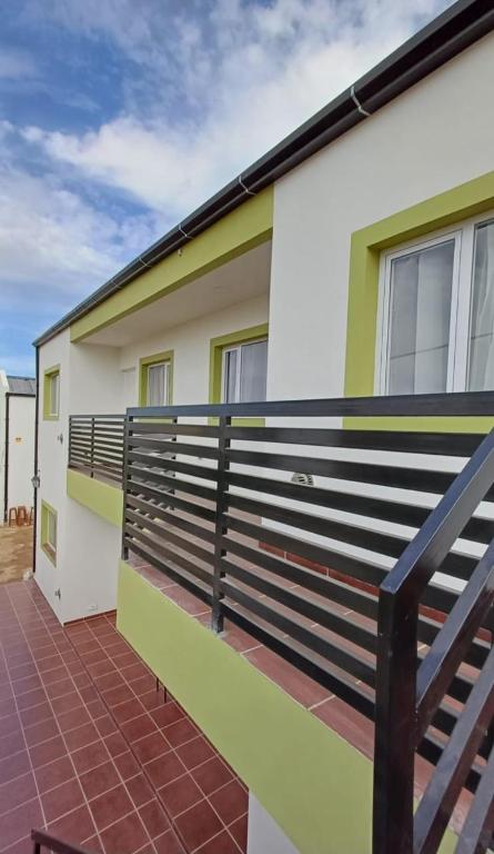 a balcony of a house with a fence at Complejo CRISMAR in Las Grutas