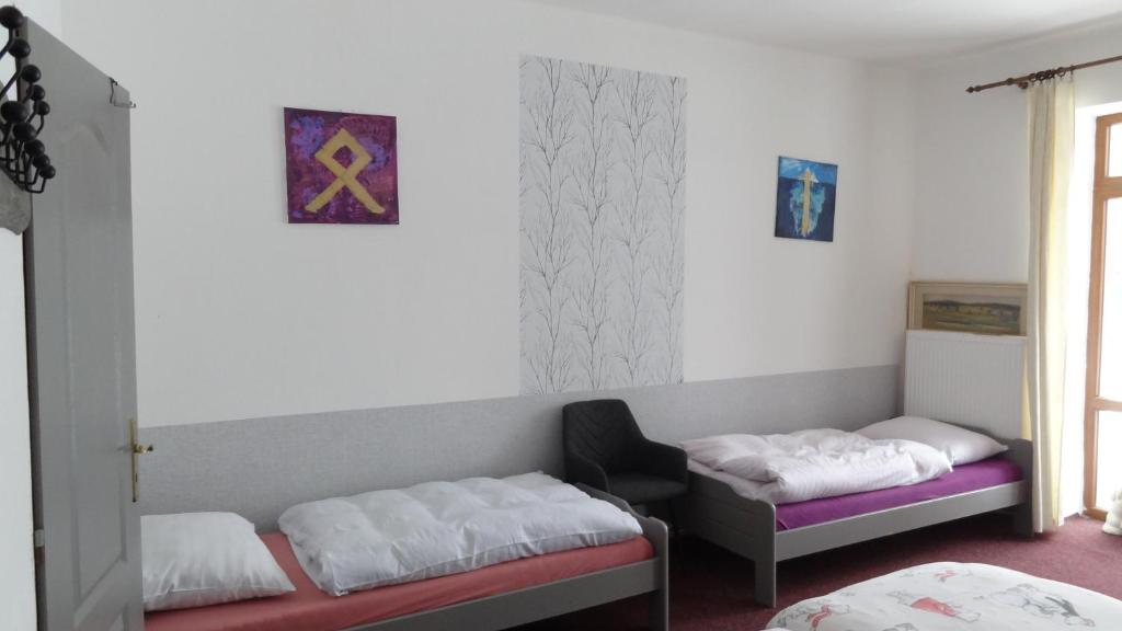 Postel nebo postele na pokoji v ubytování Statek Polánka