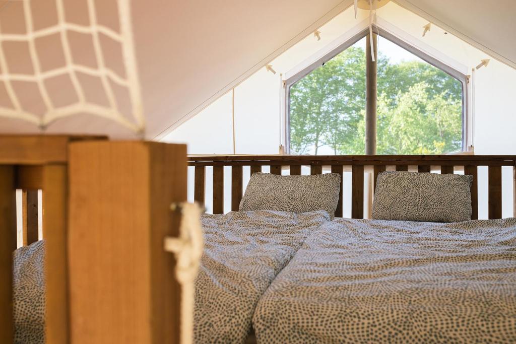Postel nebo postele na pokoji v ubytování Glamping Kolpa Resort
