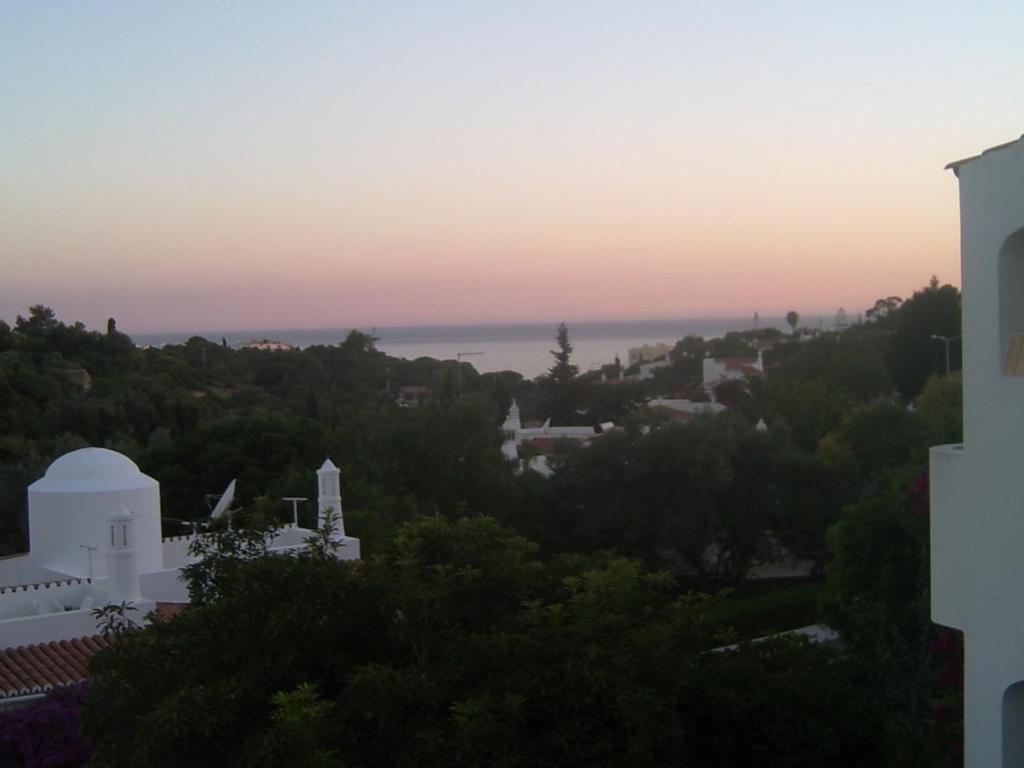 a view from the roof of a house at sunset at Casa Caracol in Praia do Carvoeiro