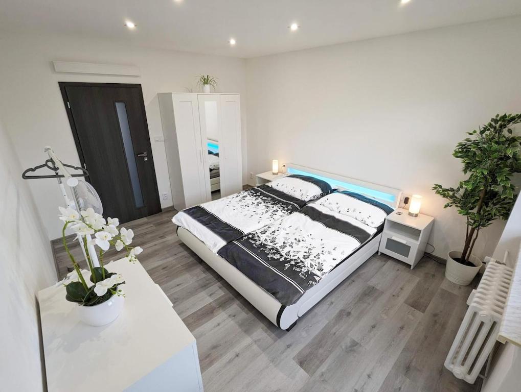 Postel nebo postele na pokoji v ubytování Smart Apartment