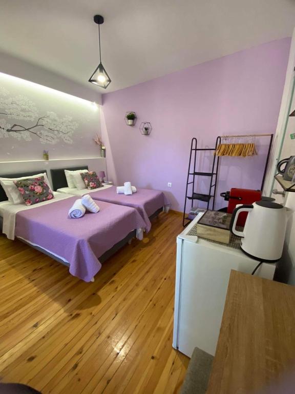 Postel nebo postele na pokoji v ubytování Takis Family Corfu