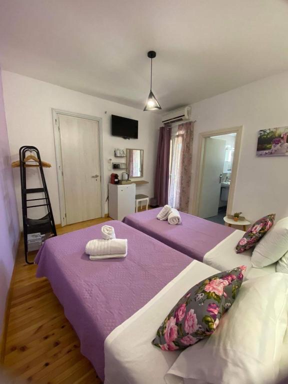 Postel nebo postele na pokoji v ubytování Takis Family Corfu