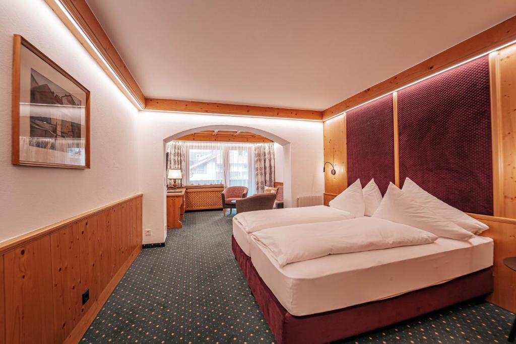 Postel nebo postele na pokoji v ubytování Hotel Grieshof