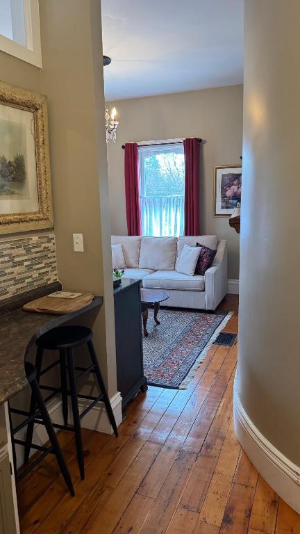 a living room with a couch and a table at The 1885 Suites in Picton