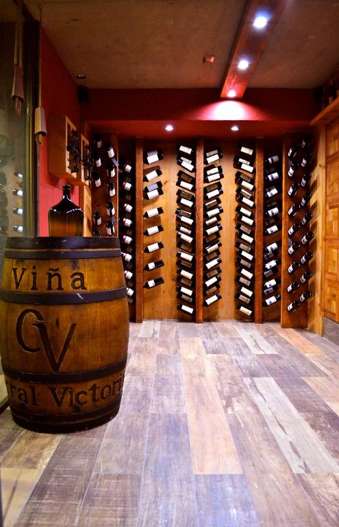 a wine cellar with a bunch of wine bottles at Ecohotel Talca in Talca