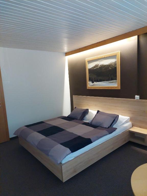 Letto o letti in una camera di Penzion Flores