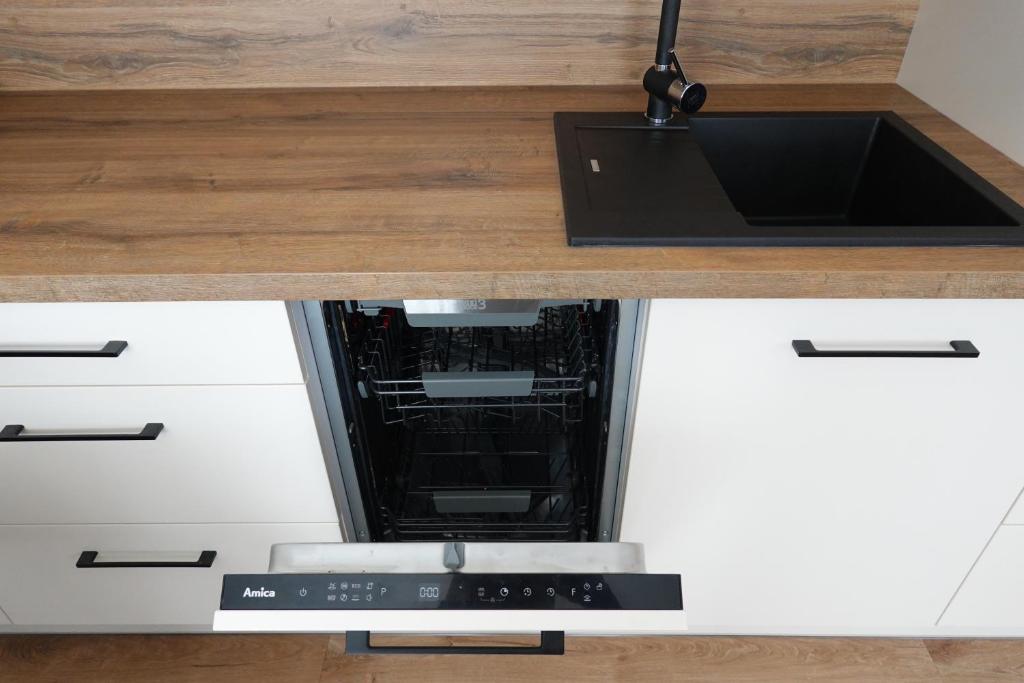 Kuchyň nebo kuchyňský kout v ubytování Apartmán Rozárka Černý Důl