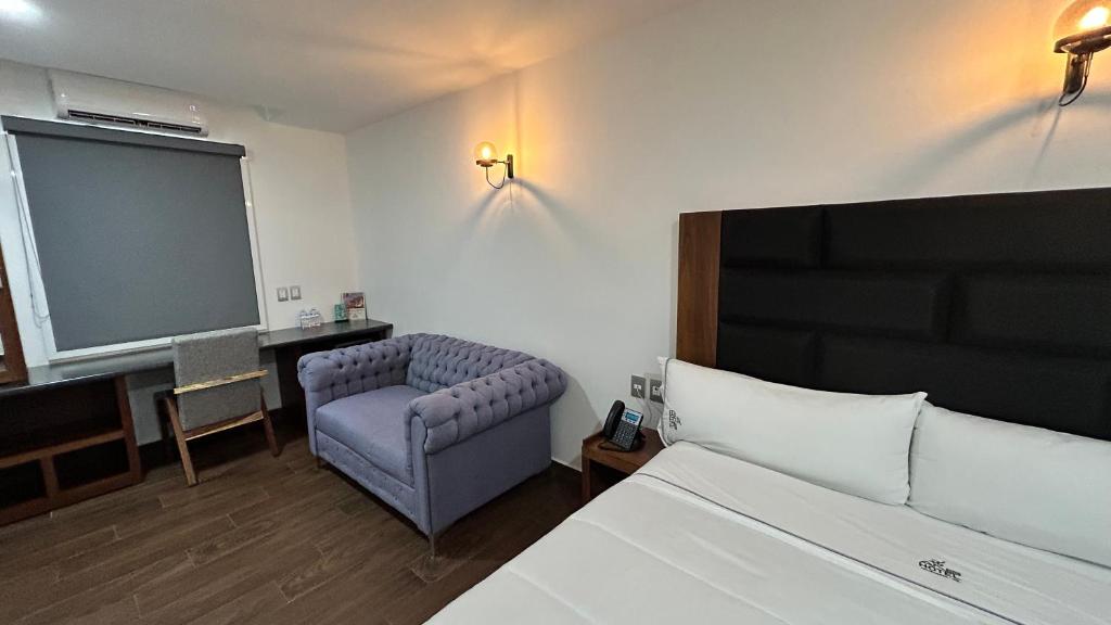 Postel nebo postele na pokoji v ubytování Hotel ANB Aeropuerto Guadalajara