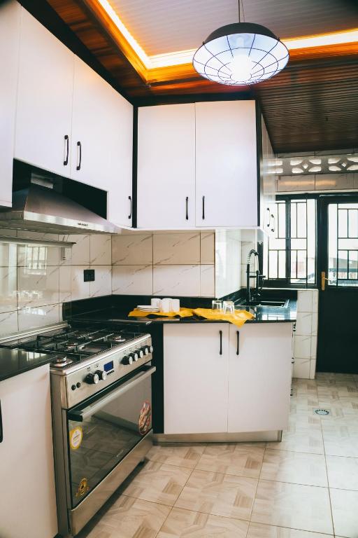 Kuchyň nebo kuchyňský kout v ubytování One Click Apartment