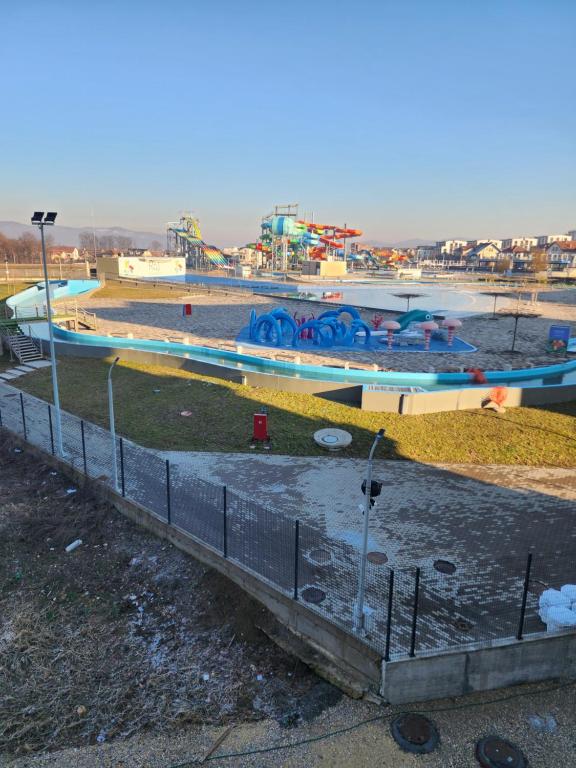 a water park with a pool and a water slide at Apartmani Nikmil Vrnjačka Banja in Vrnjci