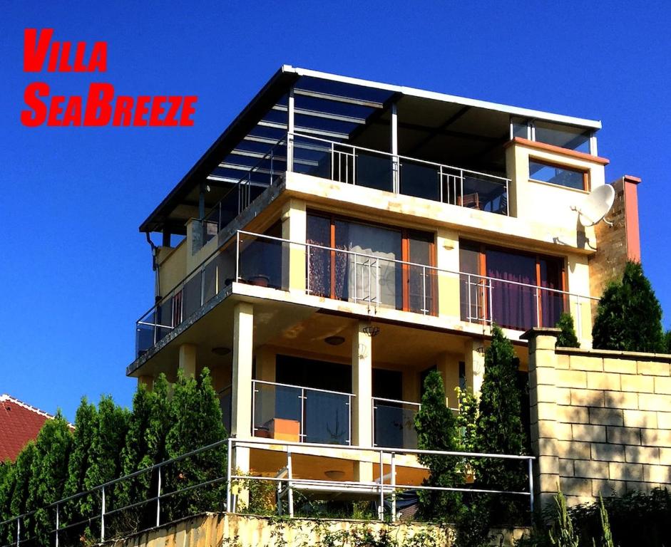 a building with balconies on the side of it at Villa SeaBreeze in Varna City