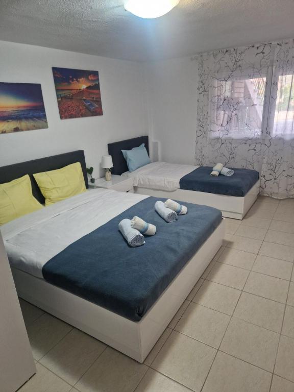 Postel nebo postele na pokoji v ubytování Pamys House