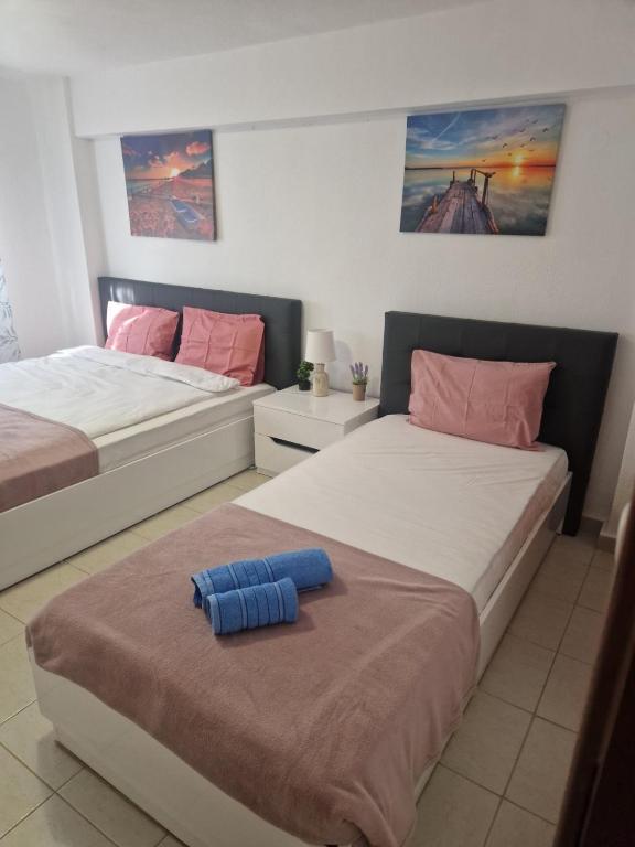Postel nebo postele na pokoji v ubytování Pamys House