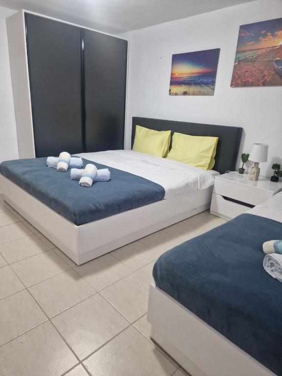 Postel nebo postele na pokoji v ubytování Pamys House