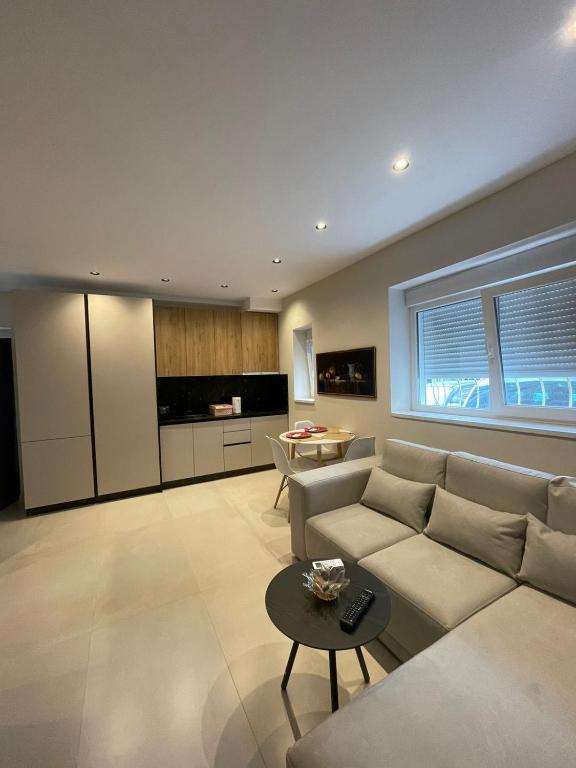 a living room with a couch and a table at Casa Tirana in Tirana